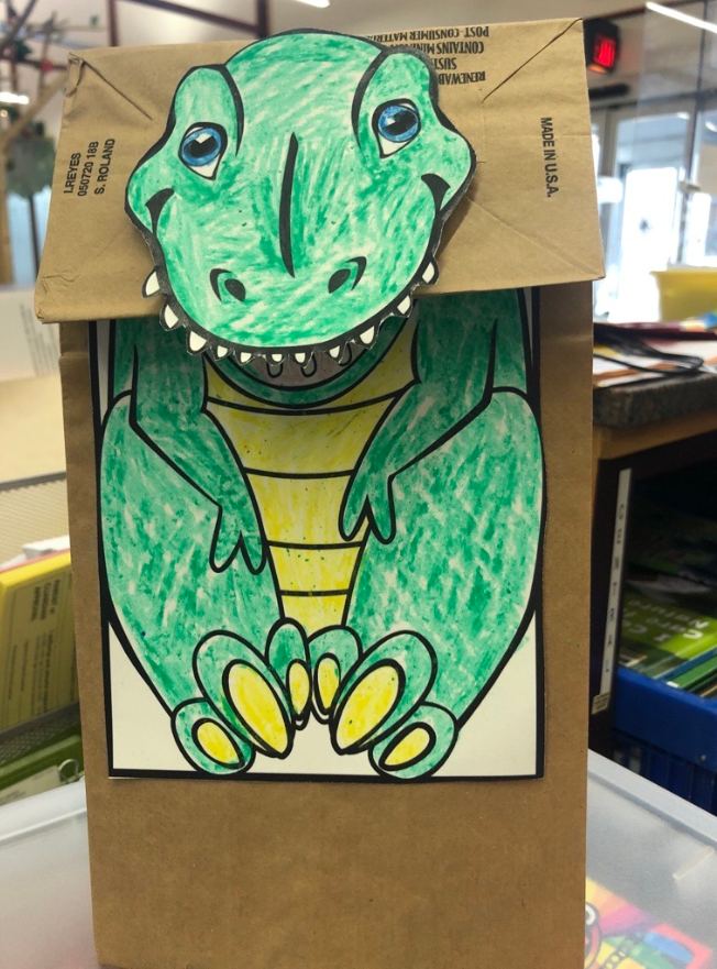 Paper bag dinosaur store puppet